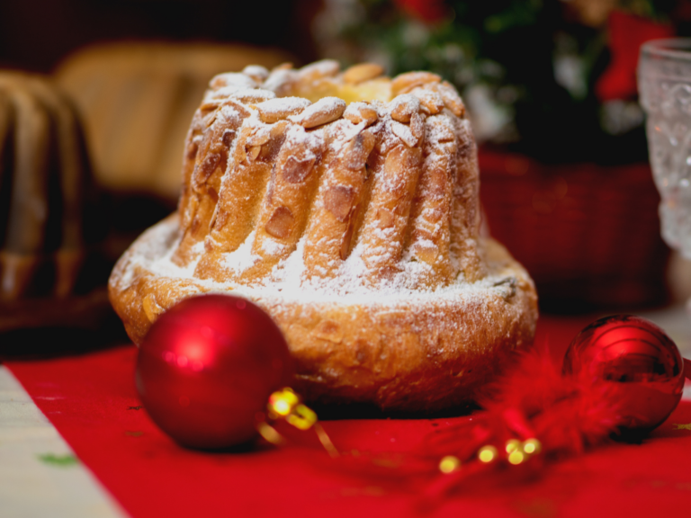 a cake with a red and gold ornament